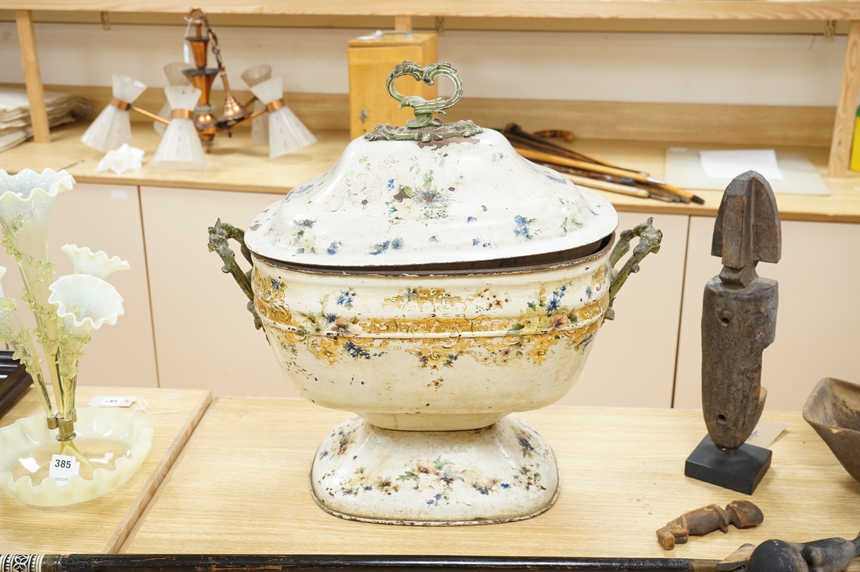 A 19th century painted toleware log box and cover hand painted with flowers, 58cm wide